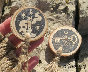 wood and tassel talismans